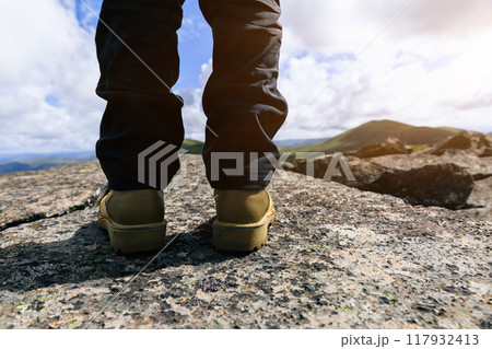 Successful hiker enjoy the view on mountain top cliff edge Successful hiker enjoy the view on mountain top cliff edge 117932413