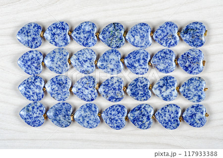 Blue Serenity: Artful Display of 28 Sodalite Hearts Combines Geometric Precision with Natural Beauty. Blue Serenity: Artful Display of 28 Sodalite Hearts Combines Geometric Precision with Natural Beauty. 117933388