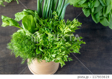 Green onions, spinach, parsley and dill. Vitamin food. Prepare greens for salad. 117933619