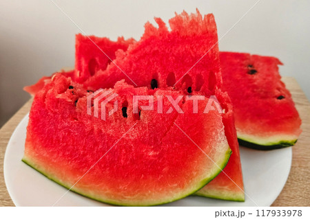Close-up of ripe juicy red watermelon pieces Close-up of ripe juicy red watermelon pieces 117933978