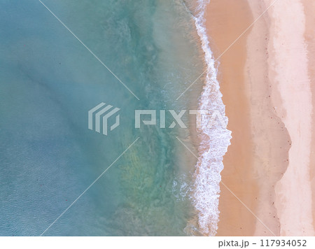 Beautiful sea beach and waves texture in sunny summer day background Beautiful sea beach and waves texture in sunny summer day background 117934052