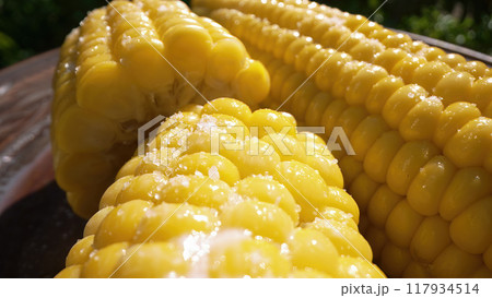 Freshly boiled tasty sweet golden corn cob. Appetizing healthy natural nutrition 117934514