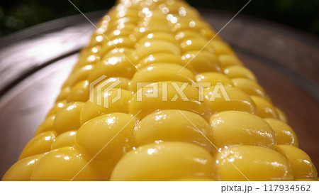 Freshly boiled tasty sweet golden corn cob. Appetizing healthy natural nutrition 117934562