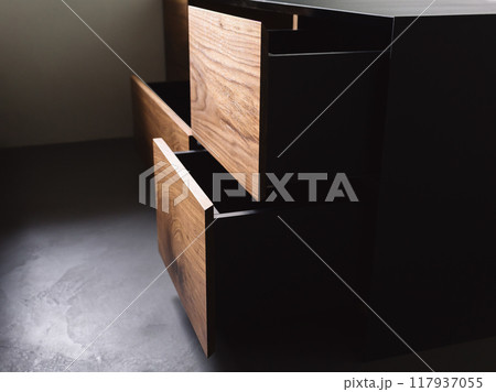 Closeup details of modern tv stand made from walnut and powder coated steed Closeup details of modern tv stand made from walnut and powder coated steed 117937055