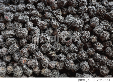 Close up photo of dried Aronia melanocarpa (black chokeberry), selective focus. Close up photo of dried Aronia melanocarpa (black chokeberry), selective focus. 117939823