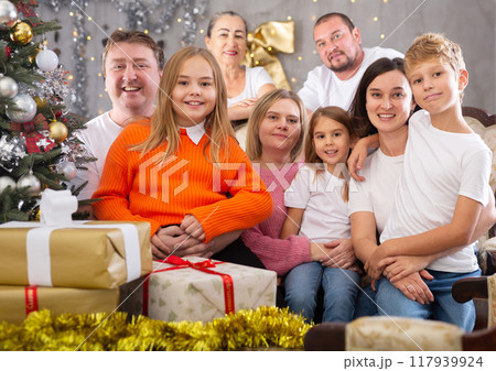 Portrait of happy family who is satisfied of presents in time celebration New Year in home 117939924