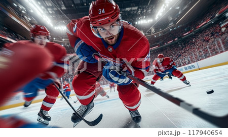 Fast-paced ice hockey game in a packed arena 117940654