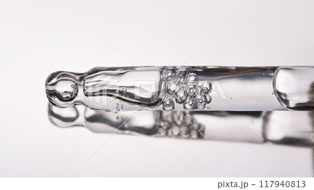 Pipette with cosmetic gel or serum close-up. 117940813