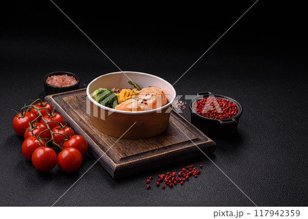 A piece of boiled salmon with rice, broccoli, salt and spices A piece of boiled salmon with rice, broccoli, salt and spices 117942359