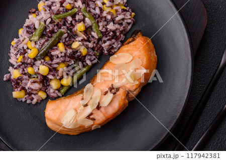 A piece of boiled salmon with rice, broccoli, salt and spices A piece of boiled salmon with rice, broccoli, salt and spices 117942381