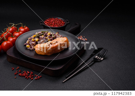 A piece of boiled salmon with rice, broccoli, salt and spices A piece of boiled salmon with rice, broccoli, salt and spices 117942383