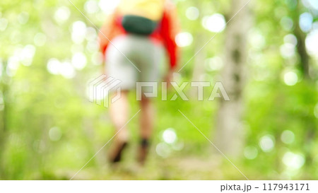 Blurred male hiker walks in the woods Blurred male hiker walks in the woods 117943171