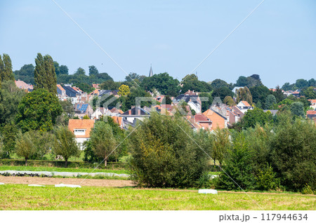 Residential houses and green hills at the Flemish countryside in Dilbeek, Brabant, Belgium Residential houses and green hills at the Flemish countryside in Dilbeek, Brabant, Belgium 117944634