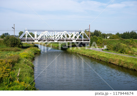 Denderleeuw, East Flemish Region, belgium, Aug 31, 2024 - The railwaybridge at line 50a over the river Dender 117944674