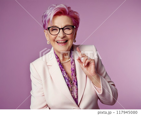 Elderly lady in floral cardigan and glasses, smiling happily for the camera Elderly lady in floral cardigan and glasses, smiling happily for the camera 117945080