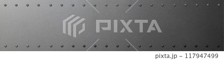 鋲が付いた金属板の背景テクスチャー 117947499