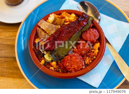 Migas with roasted pepper and pieces of chorizo in bowl Migas with roasted pepper and pieces of chorizo in bowl 117949076