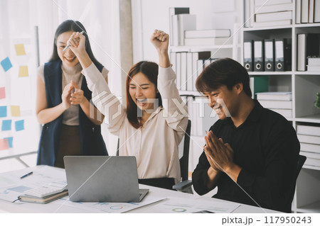 Financial analysts analyze business financial reports on a digital tablet planning investment project during a discussion at a meeting of corporate showing the results of their successful teamwork. 117950243