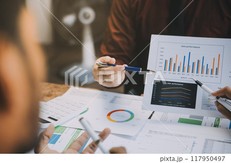 Group of Young Asian business team creative businesspeople coworker in office Happy to be successful partnership teamwork celebrating achievement and success concept. 117950497