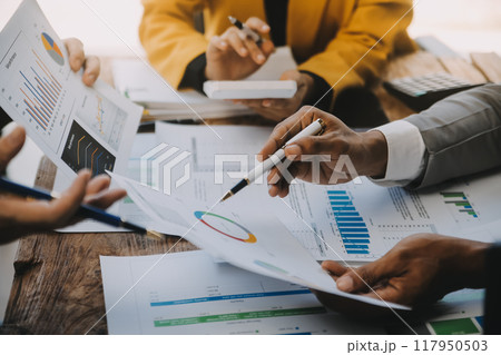 Group of Young Asian business team creative businesspeople coworker in office Happy to be successful partnership teamwork celebrating achievement and success concept. 117950503