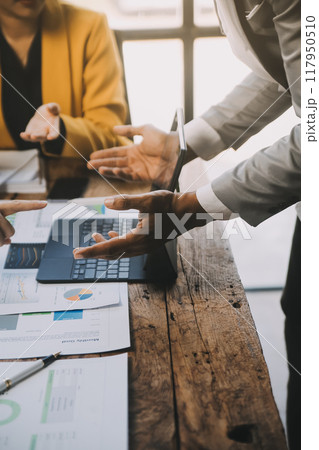 Group of Young Asian business team creative businesspeople coworker in office Happy to be successful partnership teamwork celebrating achievement and success concept. 117950510