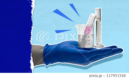 A person is holding a beaker with a liquid in it A person is holding a beaker with a liquid in it 117951588