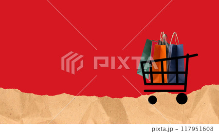 A shopping cart is filled with bags and is on a red background 117951608