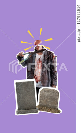 A man with a bloody head is holding a gun and standing in front of a cemetery 117951614