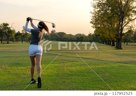 Golfer women sport course golf ball fairway.  117952525