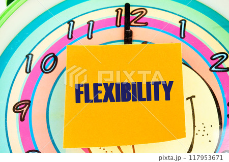 Business flexibility concept. Copy space. Flexibility symbol. Concept word Flexibility on the sticker on the background of the clock face with hands Business flexibility concept. Copy space. Flexibility symbol. Concept word Flexibility on the sticker on the background of the clock face with hands 117953671