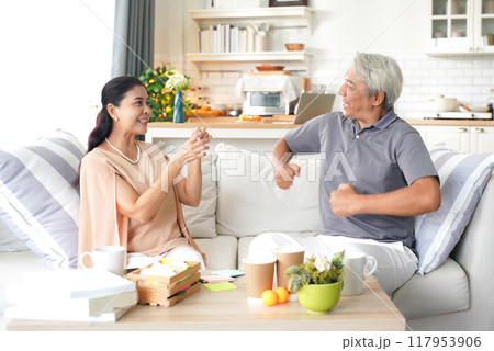 Family happy senior playing bard game enjoy and fun in living room. Family happy senior playing bard game enjoy and fun in living room. 117953906