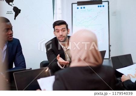 Group of diversity business people - senior executive staffs having an annual report and discussing about the business trend. Collaboration of businesspeople. Group of employees or team in meeting. 117954039