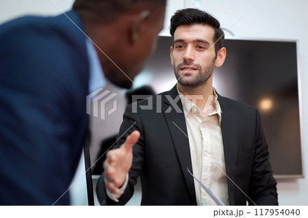 Group of diversity business people - senior executive staffs having an annual report and discussing about the business trend. Collaboration of businesspeople. Group of employees or team in meeting. 117954040