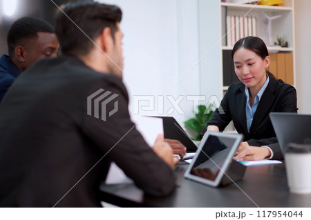 Group of diversity business people - senior executive staffs having an annual report and discussing about the business trend. Collaboration of businesspeople. Group of employees or team in meeting. 117954044