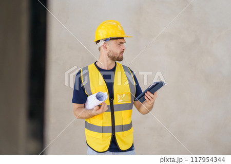 Senior professional caucasian white male real estate foreman inspecting inside the building construction, foreman checking the under construction building. Caucasian male engineer inspects interior. Senior professional caucasian white male real estate foreman inspecting inside the building construction, foreman checking the under construction building. Caucasian male engineer inspects interior. 117954344