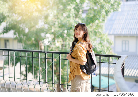 traveler young Asian woman in her 30s navigates the vibrant streets of Bangkok. Let this photo inspire your own journey. 117954660