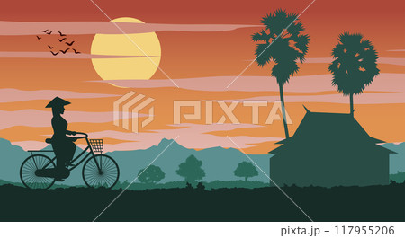 Vietnamese woman rides bicycle to comeback home on sunset time 117955206