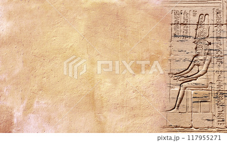 Horizontal  background with ancient Egyptian hieroglyphs and bas-relief of goddess Isis  on stone wall, Egypt, Africa. Backdrop with sandstone carving with hieroglyph. Copy space for text 117955271