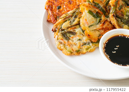 Pajeon or Korean pancake and Korean Kimchi pancake or Kimchijeon on white background Pajeon or Korean pancake and Korean Kimchi pancake or Kimchijeon on white background 117955422