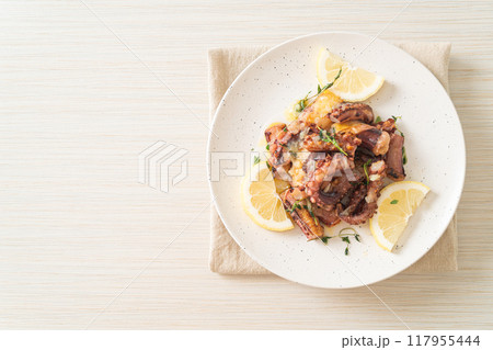grilled octopus or squid with butter lemon sauce grilled octopus or squid with butter lemon sauce 117955444