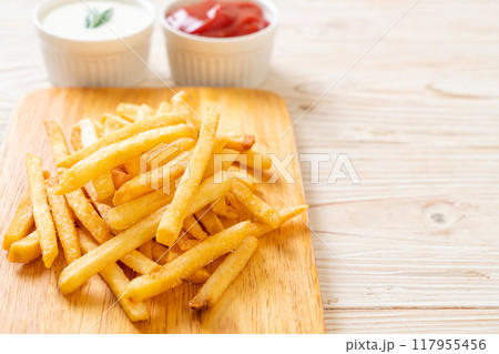 French fries with sour cream and ketchup 117955456