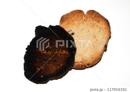 Very Burnt Bread Roll Toast and a Lightly Toasted Close Up Texture Close Up Very Burnt Bread Roll Toast and a Lightly Toasted Close Up Texture Close Up 117958392