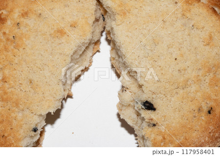 Very Burnt Bread Roll Torn or Cut in Half Toast Close Up Texture 117958401