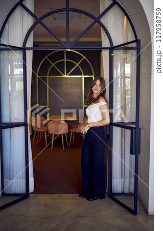 16-year-old teenage girl in old money style clothes in a fancy restaurant 16-year-old teenage girl in old money style clothes in a fancy restaurant 117958759