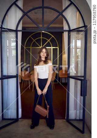 16-year-old teenage girl in old money style clothes in a fancy restaurant 16-year-old teenage girl in old money style clothes in a fancy restaurant 117958760