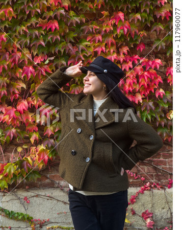 Stylish Woman in Autumn Foliage Stylish Woman in Autumn Foliage 117960077