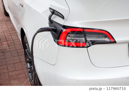 Electric Car Charging Rear View 117960710