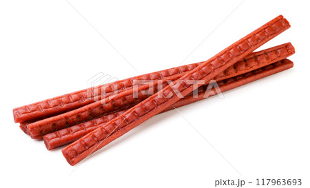 Dried salmon pieces on white background. Salmon jerky isolated Dried salmon pieces on white background. Salmon jerky isolated 117963693