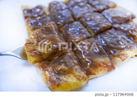Top view of Crispy Roti with Chocolate drizzle, focus selective Top view of Crispy Roti with Chocolate drizzle, focus selective 117964006