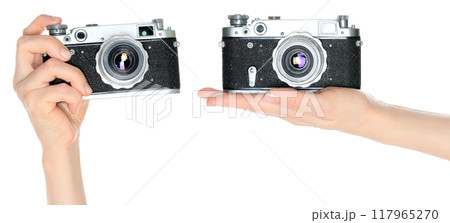 Set of Hand holds a Classic Retro Photo Camera, isolated on transparent background, front view Set of Hand holds a Classic Retro Photo Camera, isolated on transparent background, front view 117965270